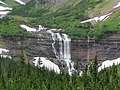 Closeup of Morning Eagle Falls with Piegan Mountain and the Bishops Cap in the background